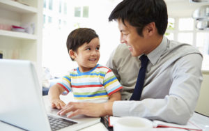 Father Working From Home With Son
