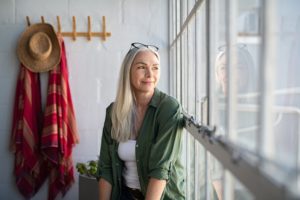 Woman Looking Out Window