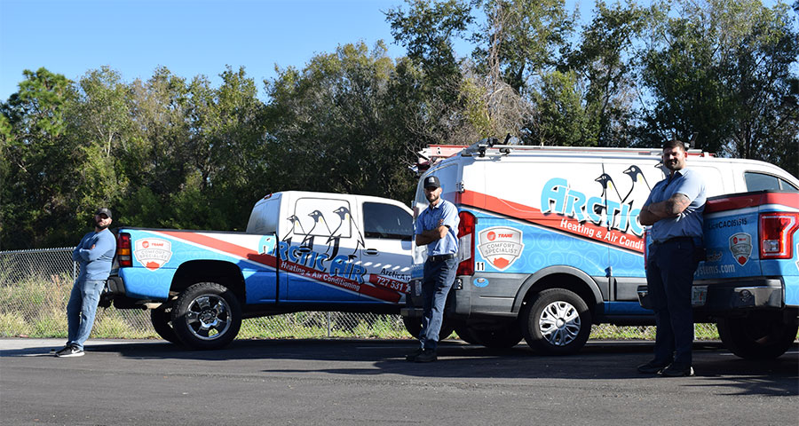 Techs leaning on vans